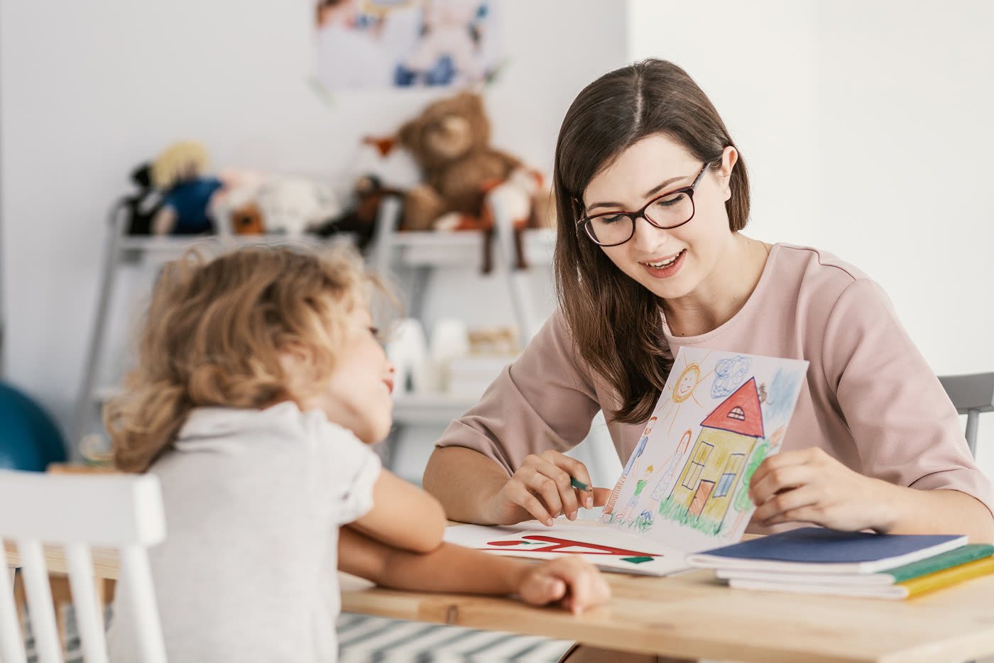 A therapist working one-on-one with a young participant